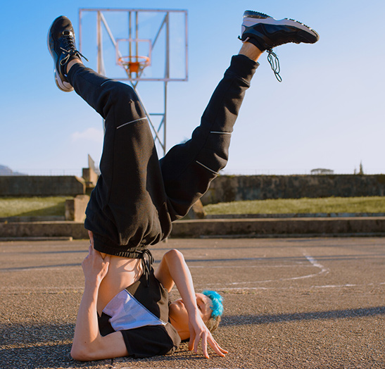 teenager-break-dancing-on-sports-ground_newsletter